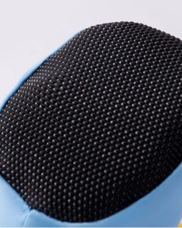 Close-up of the black textured grip sole on the light blue dog boot.