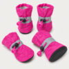 Set of four pink dog paw boots with reflective bands and black soles, on a plain background.